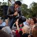 Tribute Artist Chris Ayotte of Canton holds the hand of an audience member as he performs on stage Friday evening at Elvis Fest in Ypsilanti. Jeffrey Smith | AnnArbor.com 